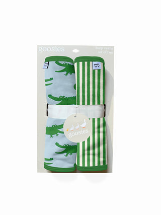 Two baby seat belt covers with alligator design in packaging on a white background