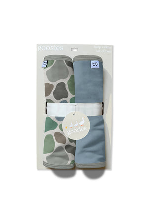 Two baby swaddles in camouflage and blue packaging on a white background