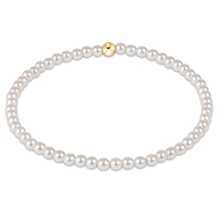 Pearl bracelet with a gold clasp on a white background