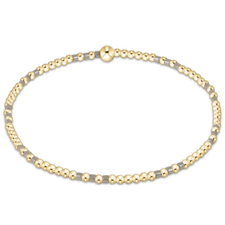 Gold and silver beaded necklace on a white background