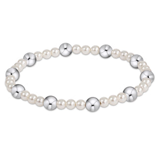 Pearl and silver bead bracelet on a white background
