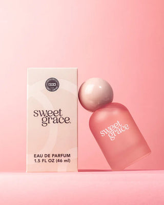 Sweet Grace perfume bottle and packaging on a pink background