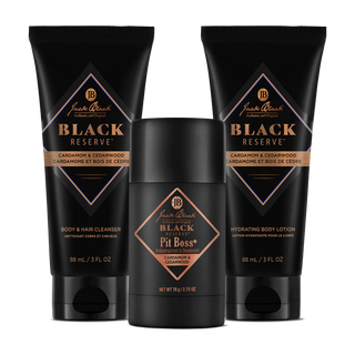Three Black Reserve body care products on a white background