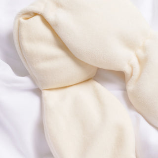 Close-up of a bone eye mask item on a white background