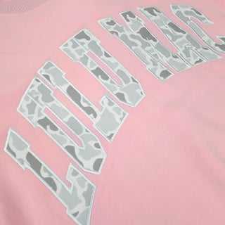 Candy Pink & Camo Crewneck featuring embroidered camo lettering, soft fleece lining, and a cozy everyday fit for kids.