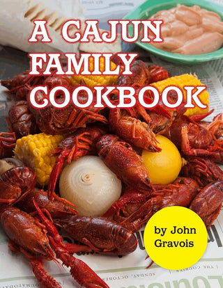 A Cajun Family Cookbook paperback by John Gravois featuring authentic Louisiana Cajun recipes for appetizers, seafood, gumbo, desserts, and traditional Southern family meals.