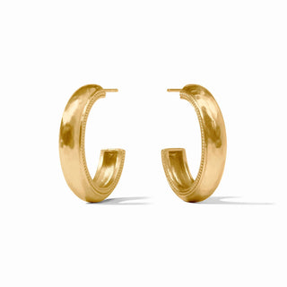 Gold hoop earrings on a white background