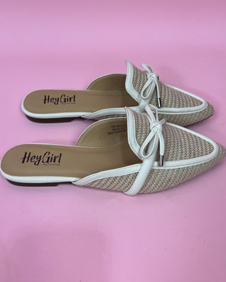 Pair of 'Hey Girl' brand shoes on a pink background