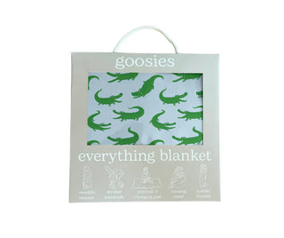 Package of a 'goosies' everything blanket with alligator pattern on a light blue background.