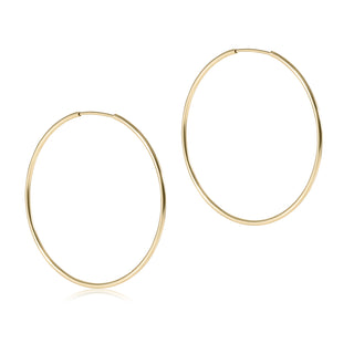Gold hoop earrings on a white background