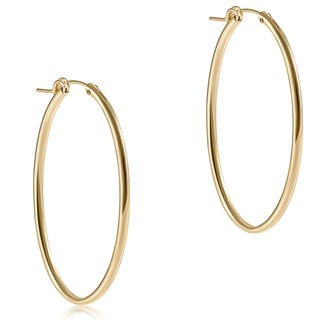 Gold hoop earrings on a white background