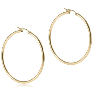 Gold hoop earrings on a white background
