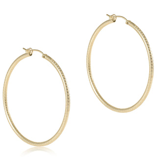 Gold hoop earrings on a white background
