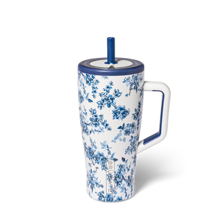 Floral-patterned tumbler with a blue handle on a white background