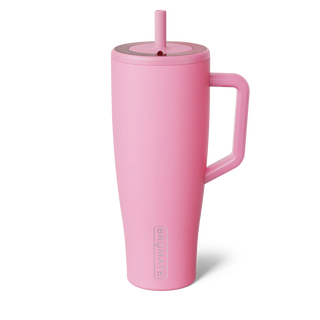 Pink insulated mug with handle and straw lid on a white background