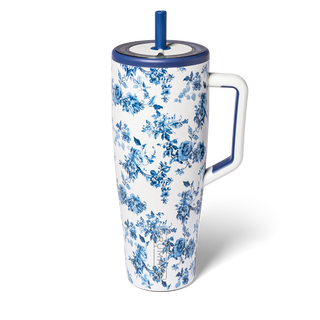 Floral-patterned mug with a handle and straw on a white background
