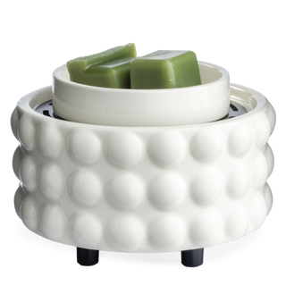 A white ceramic scented wax warmer with a textured bubble pattern and a small bowl