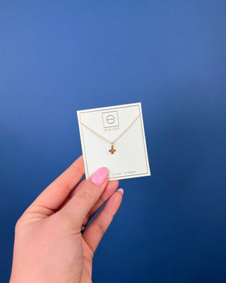 Enewton Signature Gold Cross Charm Necklace featuring a polished gold cross pendant on a delicate 16-inch gold chain displaye