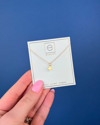 Enewton Signature Gold Cross Charm Necklace featuring a polished gold cross pendant on a delicate 16-inch gold chain displaye