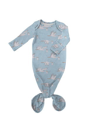 Blue baby onesie with bird pattern on a white background