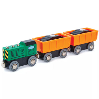 Toy train set with green engine and orange cargo cars on a white background