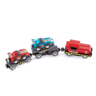 Set of toy trains in red and blue on a white background
