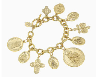 Gold charm bracelet with various charms on a white background