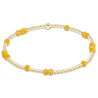 Shop the Enewton Gameday Flirty Hope Unwritten Bracelet featuring gold beads and colorful accents. Available in Black, Golden Yellow, and Red.
