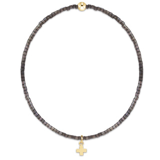 Shop the Hope Classic Signature Cross Moonlight Bracelet by enewton, featuring smoky gray beads and a delicate gold cross charm. Perfect for everyday wear.