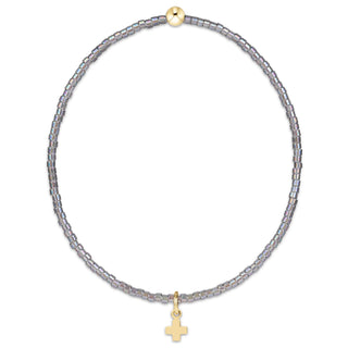 Shop the Enewton Hope Classic Signature Cross Morning Mist Bracelet featuring iridescent gray glass beads and a delicate gold cross charm.