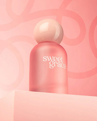 Pink bottle of 'sweet grace' on a pink background