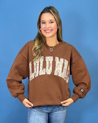 a brown crewneck sweatshirt with LULU MAC on sweatshirt.