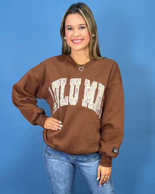 a brown crewneck sweatshirt with LULU MAC on sweatshirt.
