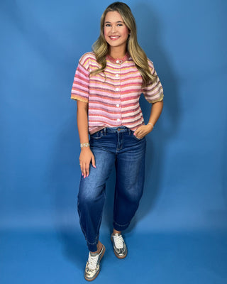  a soft fuzzy knit, colorful stripe pattern, button-front design, lightweight sweater construction, and relaxed fit.