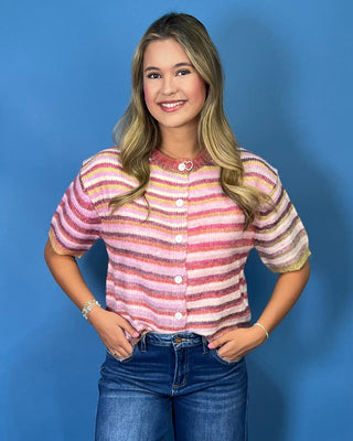 a soft fuzzy knit, colorful stripe pattern, button-front design, lightweight sweater construction, and relaxed fit.