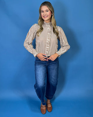 chestnut and ivory stripes, feminine ruffle details, a functional button front, and lightweight woven fabric