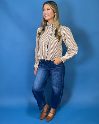 chestnut and ivory stripes, feminine ruffle details, a functional button front, and lightweight woven fabric