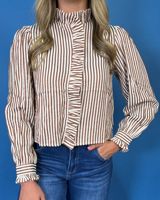 chestnut and ivory stripes, feminine ruffle details, a functional button front, and lightweight woven fabric