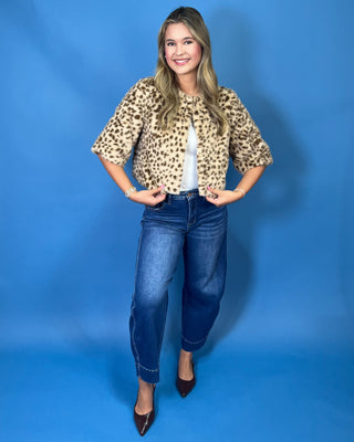 faux fur, a timeless leopard print, satin lining, open front design, and cropped silhouette