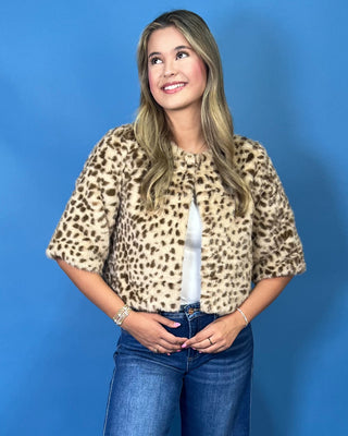 faux fur, a timeless leopard print, satin lining, open front design, and cropped silhouette