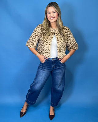 faux fur, a timeless leopard print, satin lining, open front design, and cropped silhouette