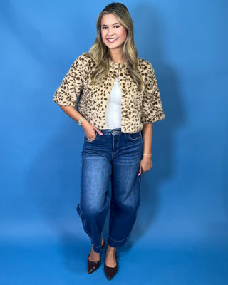 faux fur, a timeless leopard print, satin lining, open front design, and cropped silhouette
