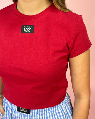 Red t-shirt with Lulu Mac logo on a pink background