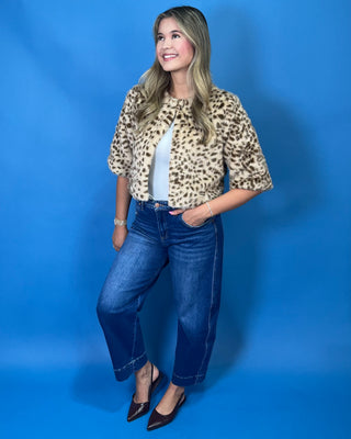faux fur, a timeless leopard print, satin lining, open front design, and cropped silhouette