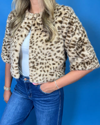 faux fur, a timeless leopard print, satin lining, open front design, and cropped silhouette
