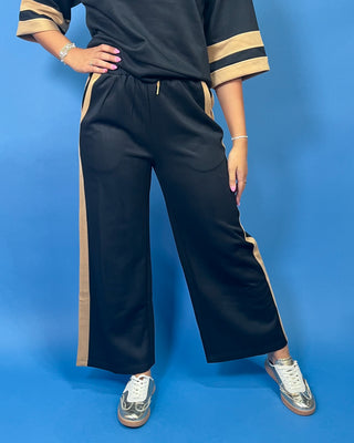 quarter zip top, wide leg pants, camel contrast trim, side pockets, elastic drawstring waist, and soft stretch fabric