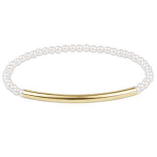 Pearl bracelet with a gold bar on a white background