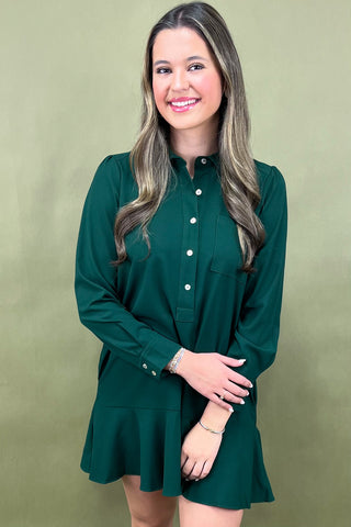 Woman wearing a green dress against a green background