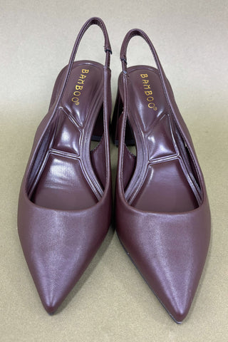 Pair of maroon high-heeled shoes branding on a beige background