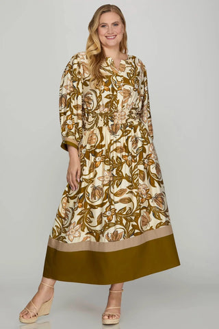 Woman wearing a floral dress with a plain background